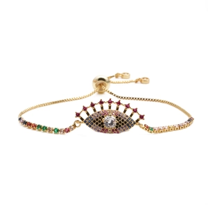 Adjustable gold evil eye bracelet with colorful cubic zirconia and sliding clasp detail
