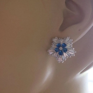 Snowflake zircon stud earrings with blue teardrop stones and sparkling silver petals