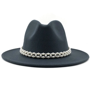 Detail of elegant black wool fedora hat featuring double-layer pearl band decoration