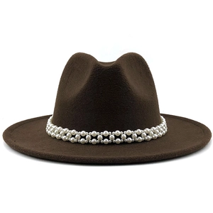 Close-up of pearl beaded band decoration on a wide brim dark brown wool fedora hat