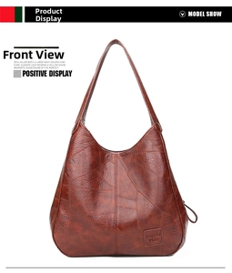 Detailansicht der braunen Retro-Tasche mit Patchwork-Nähten und geprägtem Logo