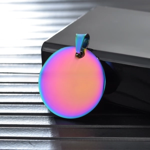 Macro detail of rainbow PVD plated stainless steel round pendant with gradient finish