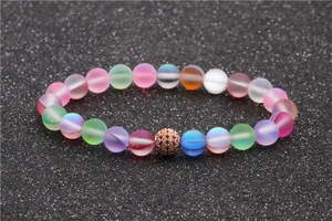 Macro shot of colorful frosted moonstone beads with rose gold crystal ball spacer