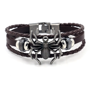 Punk vintage brown braided leather bracelet featuring a silver metal spider pendant