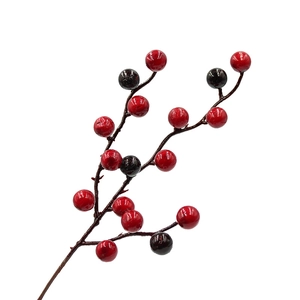 Artificial red and dark purple Christmas berries branch for holiday floral decoration