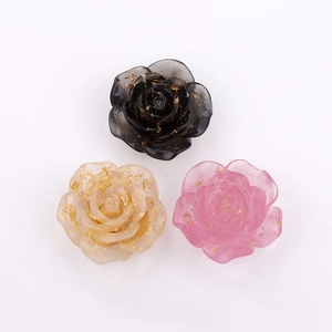 Macro shot of 22mm candy-colored resin rose charms with gold foil flakes for DIY jewelry