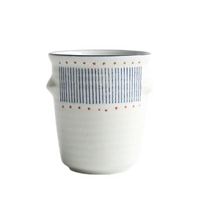 Japanese ceramic utensil holder with blue stripes and red dots on a white base