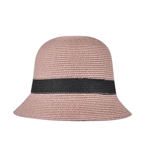 Close-up of pink woven bucket hat featuring a wide black decorative ribbon band