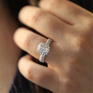 Elegant halo diamond ring set with round brilliant stone and pavé band for women
