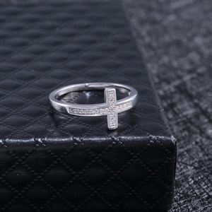 Micro-pave zircon cross ring in silver finish displayed on black leather box