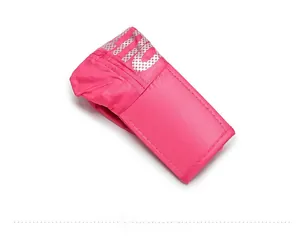 Close-up of pink foldable sun hat fabric with glossy texture and silver logo detail