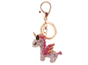 Close-up of golden unicorn keychain with sparkling crystal rhinestones and pink wings