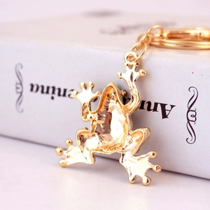 Golden frog keychain with crystal accents and green rhinestones for handbags