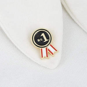 Detailed view of No 1 enamel medal brooch pinned on a white fabric shirt collar