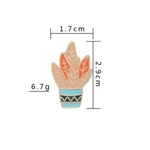 Detail view of enamel plant brooch with dimensions 1.7cm by 2.9cm and weight 6.7g