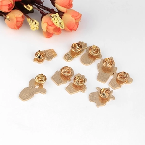 Set of 9 gold-plated cactus and plant enamel pins showing butterfly clutch backs