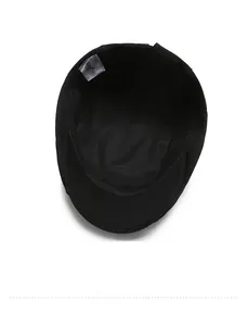 Detailed interior of the cotton newsboy cap showing neat stitching and wash label