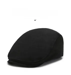 Detailed close-up of a classic black flat cap with high-quality twill cotton texture