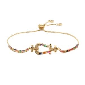 Adjustable gold horseshoe bracelet with multicolored cubic zirconia crown setting