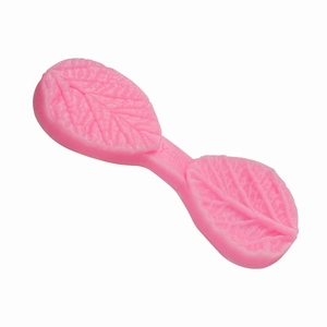 Pink silicone leaf mold with detailed vein texture for fondant and chocolate baking