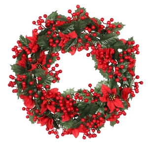 Artificial Christmas wreath with red poinsettia flowers and berries on white background