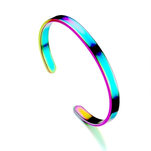 Macro side view of a polished rainbow titanium steel C-shaped open cuff bracelet