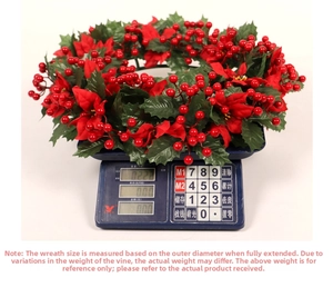 Detail showing artificial Christmas wreath weighing approximately 222g on a scale