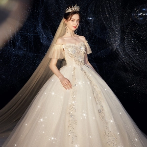 Champagne off-shoulder bridal gown with luxury sequins, embroidery and floor-length veil