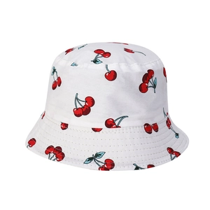 Reversible cotton bucket hat for women and men featuring red cherry prints on white fabric