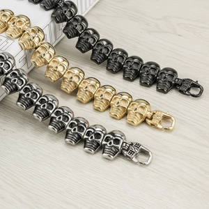 Gothic skull link bracelet for men in silver, gold, and black stainless steel colors