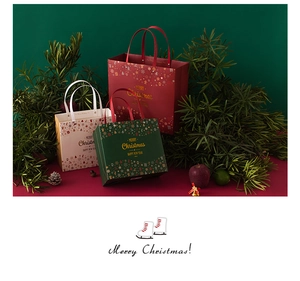 Close-up of vintage Christmas gift bags with snowflake patterns and Merry Christmas text