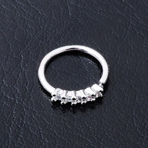 Polished silver body piercing jewelry with clear zircon flower on textured leather