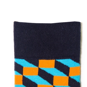 Close-up of ribbed navy cuff and orange geometric patterns on long cotton socks