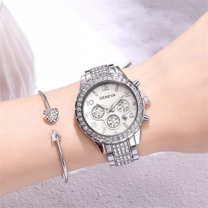 Macro shot of silver Geneva watch set with luxury crystal-encrusted heart bracelet