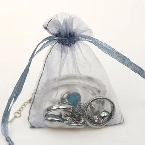 Blue organza drawstring pouch for jewelry packaging with semi-transparent fabric mesh