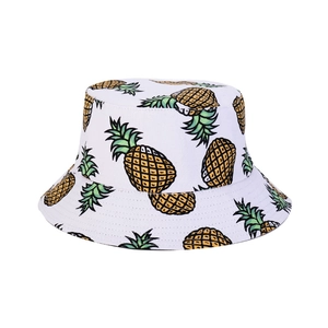 White cotton bucket hat with yellow pineapple print for summer outdoor sun protection