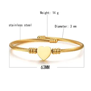 Stainless steel twisted cable bracelet with a golden heart charm and 14g weight detail