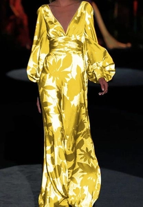 Detailed view of yellow V-neck maxi dress with puff sleeves and vibrant floral prints