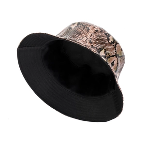 Stylish double-sided bucket hat featuring brown snake skin pattern and black fabric