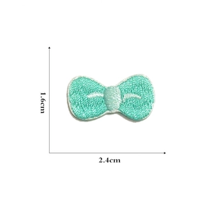 Detailed dimensions of 1.6x2.4cm mint green embroidered bow patch for DIY projects