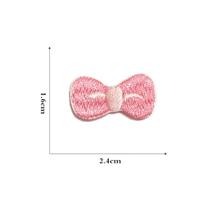 Detailed view of pink bow embroidery patch with precise dimensions 2.4cm by 1.6cm