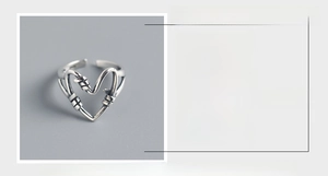 Detailed view of handmade S925 sterling silver heart-shaped ring with vintage finish