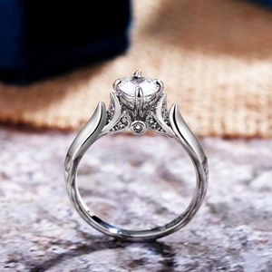 Elegant silver engagement ring featuring a six-prong AAA zircon stone with hollow patterns