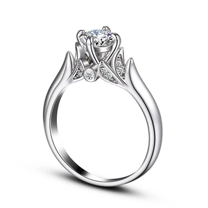 Detail view of a classic six-prong set round cubic zirconia ring with leaf-shaped accents