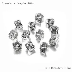 Détail macro de perles d'espacement 8x6mm argent vieilli avec trou 4,5mm pour bijoux DIY