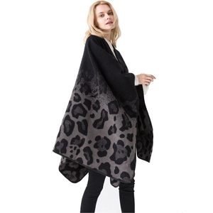 Women's leopard print shawl cape with geometric knit pattern in black and grey gradient