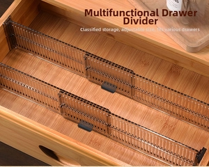 Close-up of adjustable translucent brown plastic drawer dividers in a wooden drawer