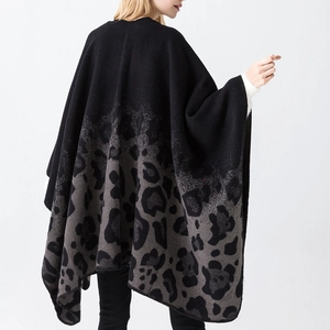 Detail of leopard print jacquard knitting and thick texture on a two-tone stylish poncho