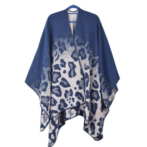 Detail of navy blue and beige leopard print knitted shawl with premium overlock edge