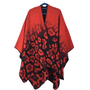 Detail of red and black leopard print knit shawl featuring high-quality hemmed edges
